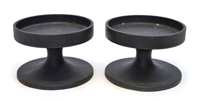 Lot 173 - Pair of Robert Welch cast iron candle holders