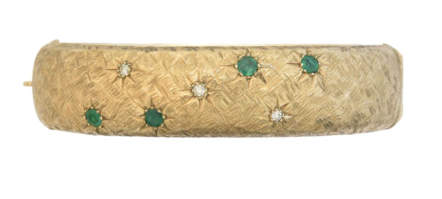Lot 44 - A 9ct gold emerald and diamond hinged bangle by Cropp & Farr