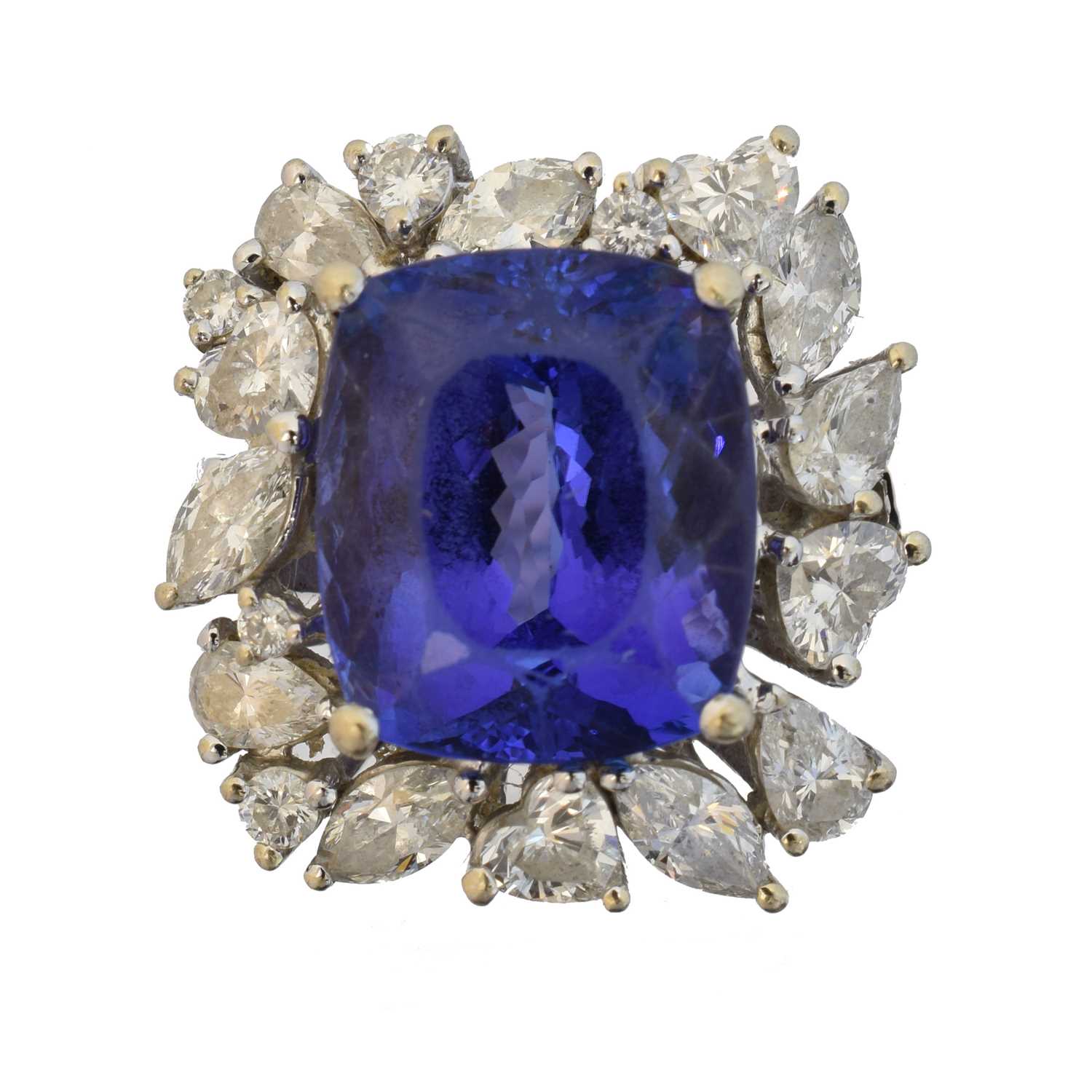 Lot An 18ct gold tanzanite and diamond cluster ring