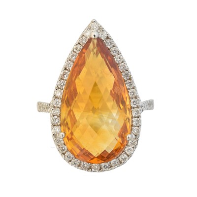 Lot 101 - A citrine and diamond cluster ring