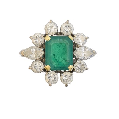 Lot 36 - An 18ct gold emerald and diamond cluster ring by Boodles & Dunthorne
