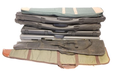 Lot 204 - Four Rifle / Shotgun hard cases and four gunslips, one with two compartments