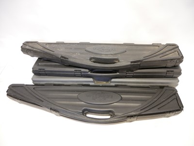 Lot 204 - Four Rifle / Shotgun hard cases and four gunslips, one with two compartments