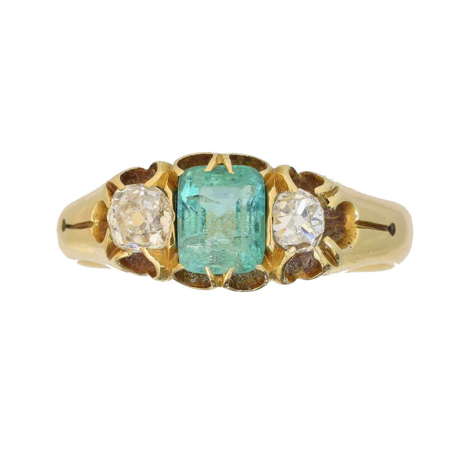Lot A late Victorian 18ct gold emerald and diamond three stone ring