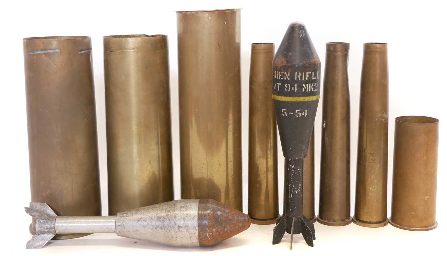 Lot 293 - Eight artillery shell cases and two dummy
