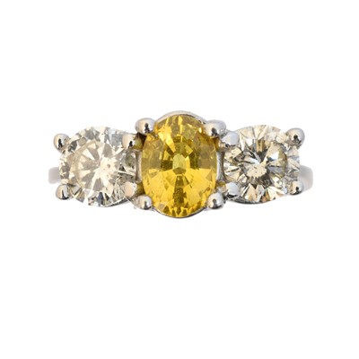 Lot 138 - An 18ct gold sapphire and diamond three stone ring