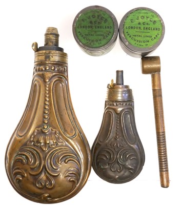 Lot 193 - Two powder flasks, a measure and two Joyce cap tins