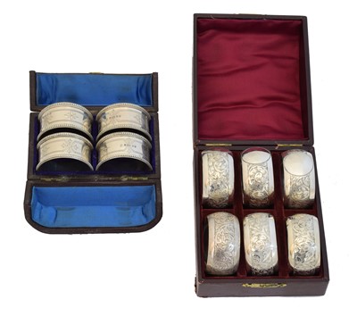 Lot 137 - Two cased silver sets of napkin rings