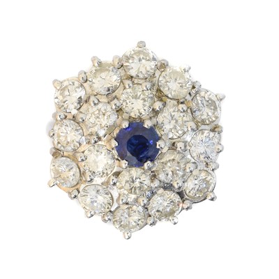 Lot 157 - A sapphire and diamond cluster ring