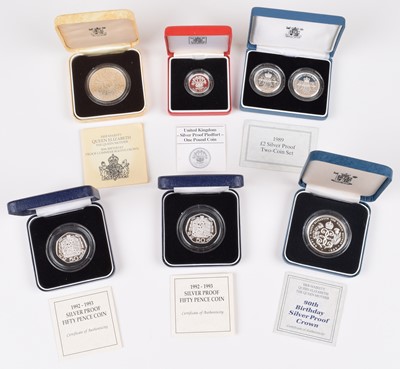 Lot 63 - Twenty-Two Royal Mint cased silver proof coins and coin sets (22).