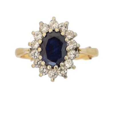Lot 154 - A sapphire and diamond cluster ring