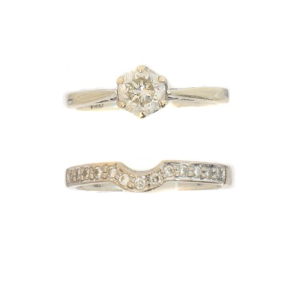Lot 144 - Two 18ct gold diamond dress rings