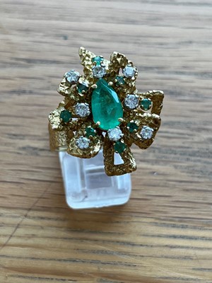 Lot 151 - A 1970s French emerald and diamond cluster ring