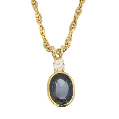 Lot 77 - A synthetic sapphire and diamond pendant