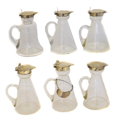 Lot 124 - Six Edward VII and later silver and clear glass toddy jugs