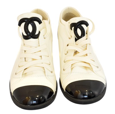 Lot 202 - A pair of Chanel leather trainers