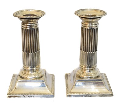Lot 156 - A pair of Victorian silver candlesticks