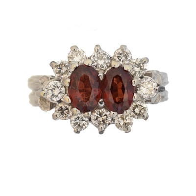 Lot 120 - A garnet and diamond cluster ring