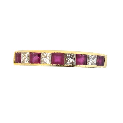 Lot 115 - An 18ct gold ruby and diamond band ring