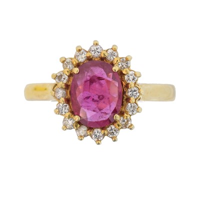 Lot 114 - An 18ct gold ruby and diamond cluster ring