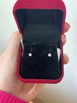Lot 56 - A pair of 9ct gold diamond stud earrings