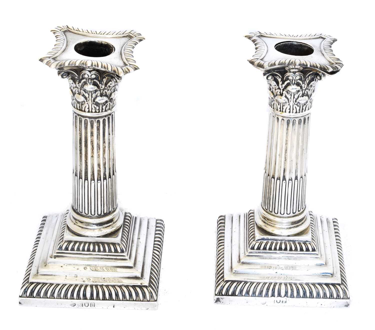 116 - A pair of Edward VII silver candlesticks,