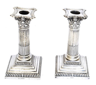 Lot 116 - A pair of Edward VII silver candlesticks