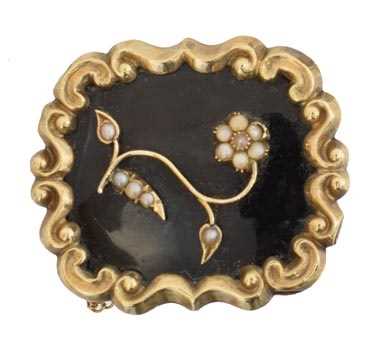 Lot 12 - A Victorian enamel and split pearl mourning brooch