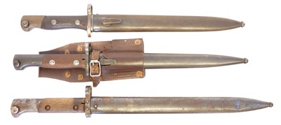 Lot 265 - Three Mauser rifle bayonets and scabbards.