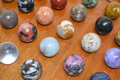 Lot 194 - Specimen Stone Marbles on a Solitaire Board