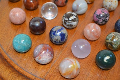 Lot 194 - Specimen Stone Marbles on a Solitaire Board