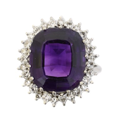 Lot 216 - An 18ct gold amethyst and diamond cluster ring
