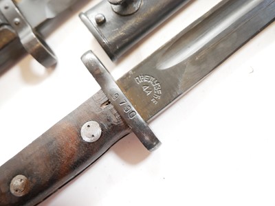 Lot 217 - Three Mauser rifle bayonets and scabbards