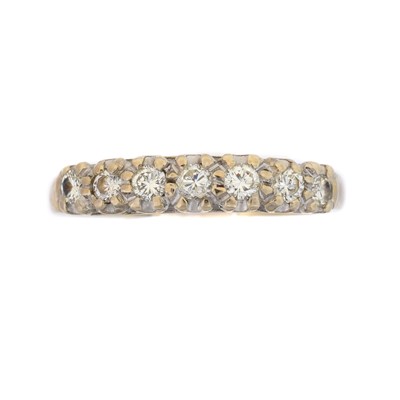 Lot 234 - An 18ct gold diamond band ring