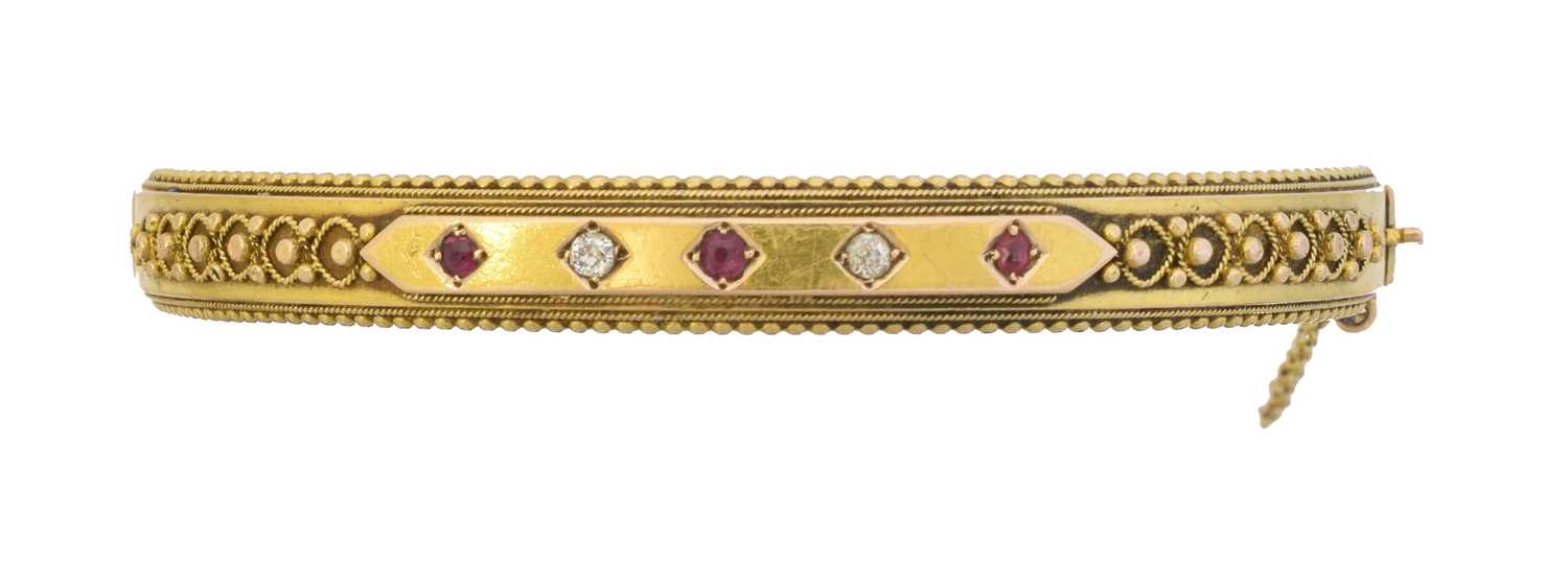 Lot 65 - A late Victorian 15ct gold ruby and diamond hinged bangle