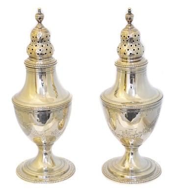 Lot 68 - A pair of George III silver casters