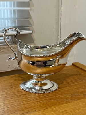 Lot 49 - A pair of George III silver sauce boats