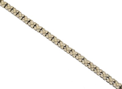 Lot 31 - An 18ct gold diamond line bracelet