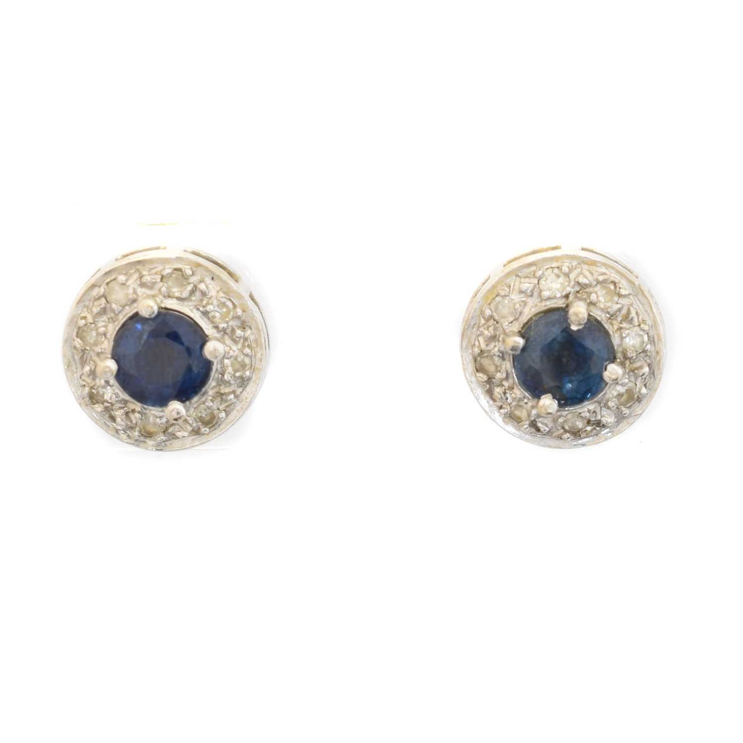 Lot 34 - A pair of sapphire and diamond earrings