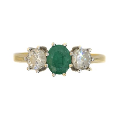 Lot 197 - An 18ct gold emerald and diamond three stone ring