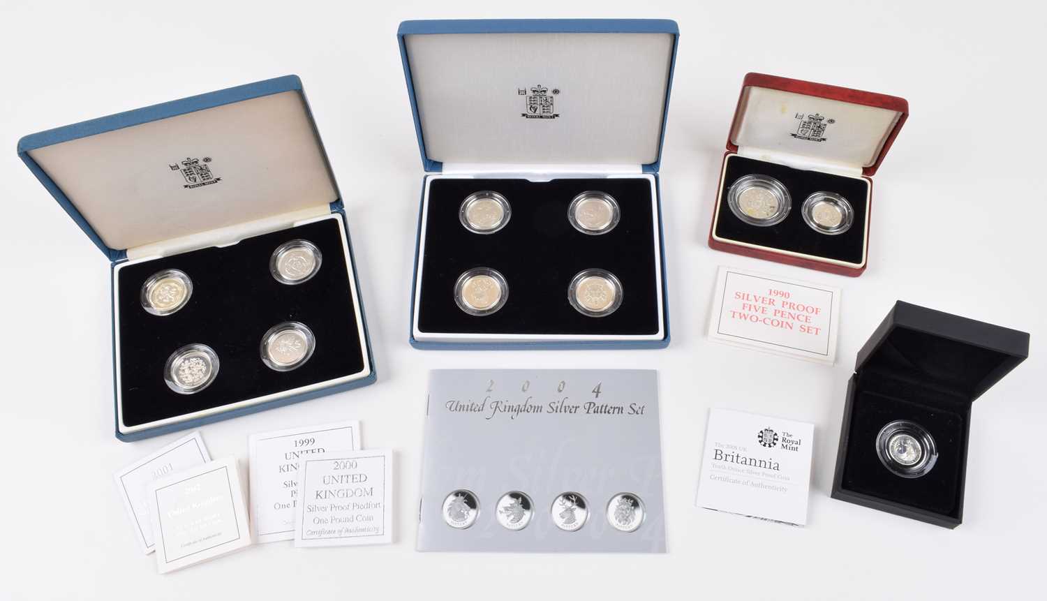 Lot 6 - Four Royal Mint Silver Proof Coins and Coin Sets (4).