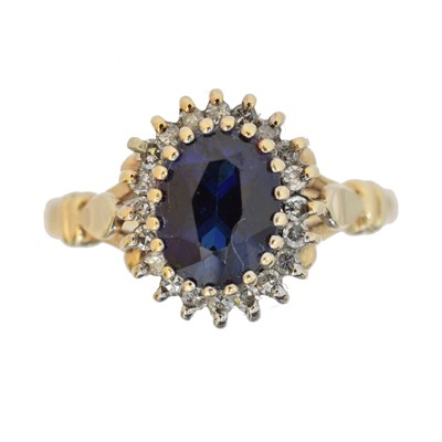 Lot 87 - A 9ct gold synthetic sapphire and diamond cluster ring