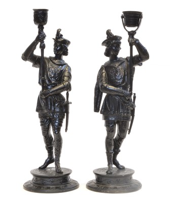 Lot 67 - Two 19th century spelter figures of soldiers holding braziers