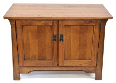 Lot 73 - Arts & Crafts style oak side cabinet by 'Sherry'