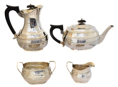Lot 100 - A George VI silver four piece tea set
