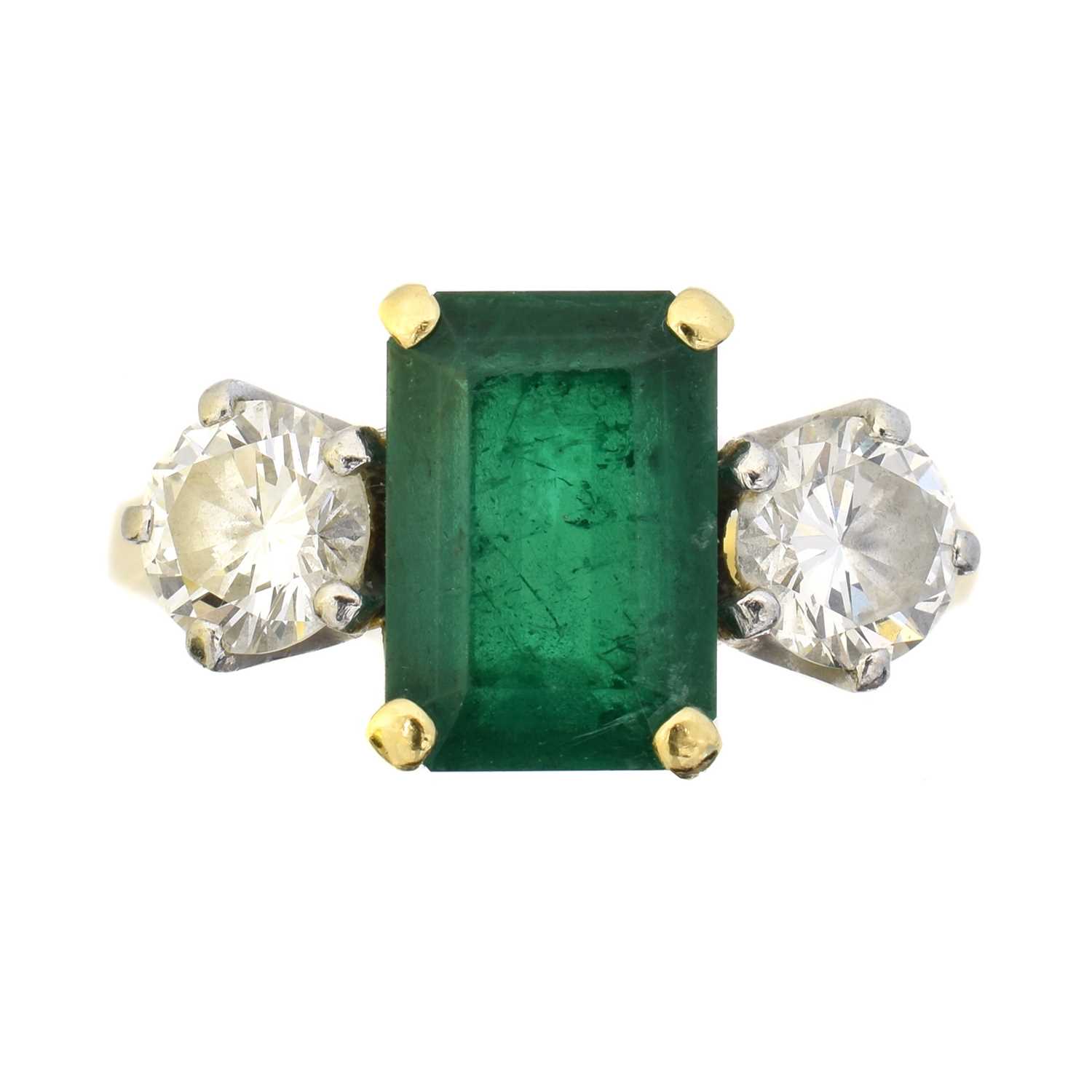 Lot 111 - An 18ct gold emerald and diamond ring by Garrard