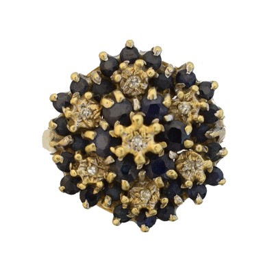 Lot 165 - An 18ct gold sapphire and diamond cluster ring