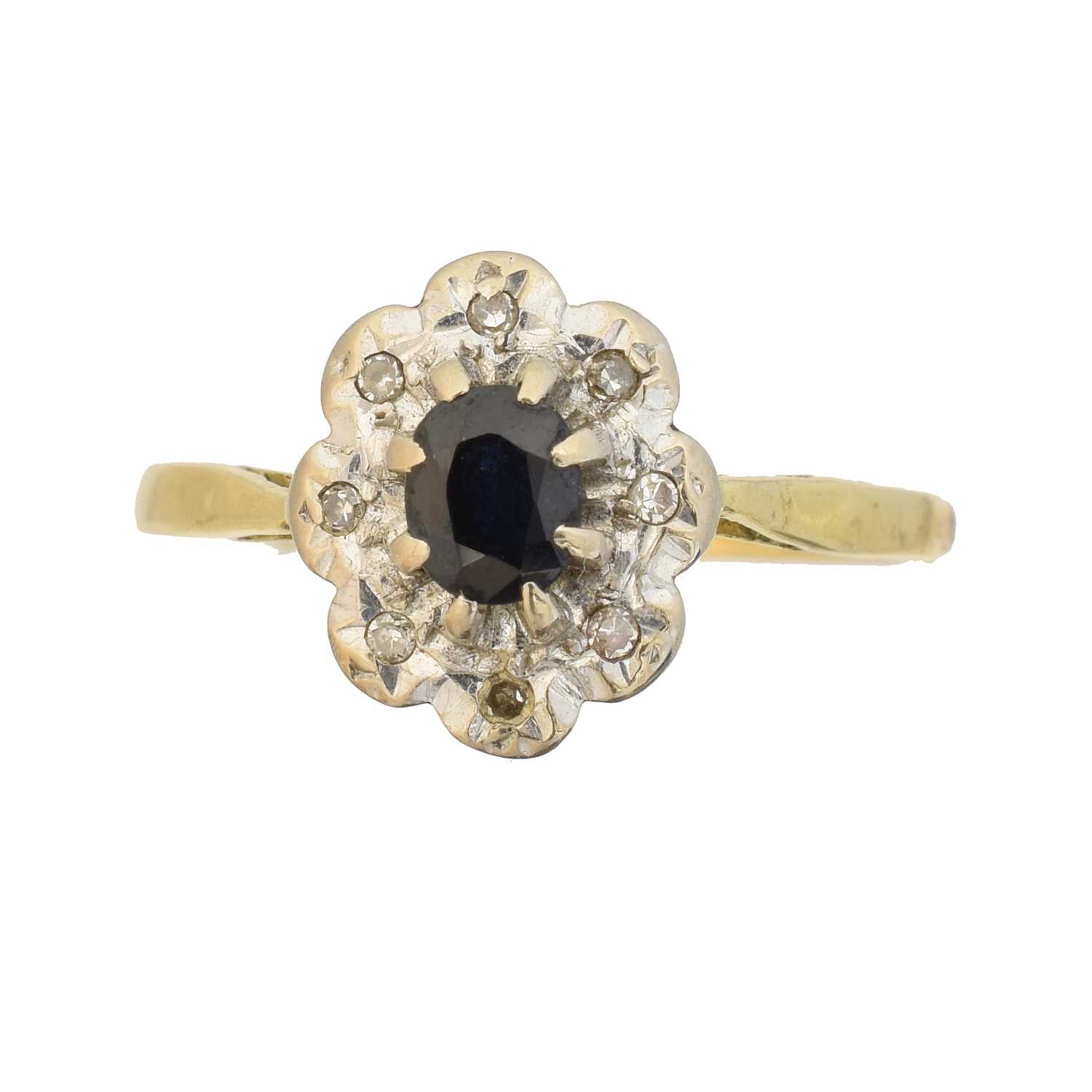 Lot 79 - An 18ct gold sapphire and diamond cluster ring