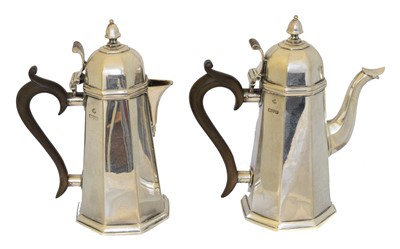 Lot 99 - A pair of George V silver coffee pots