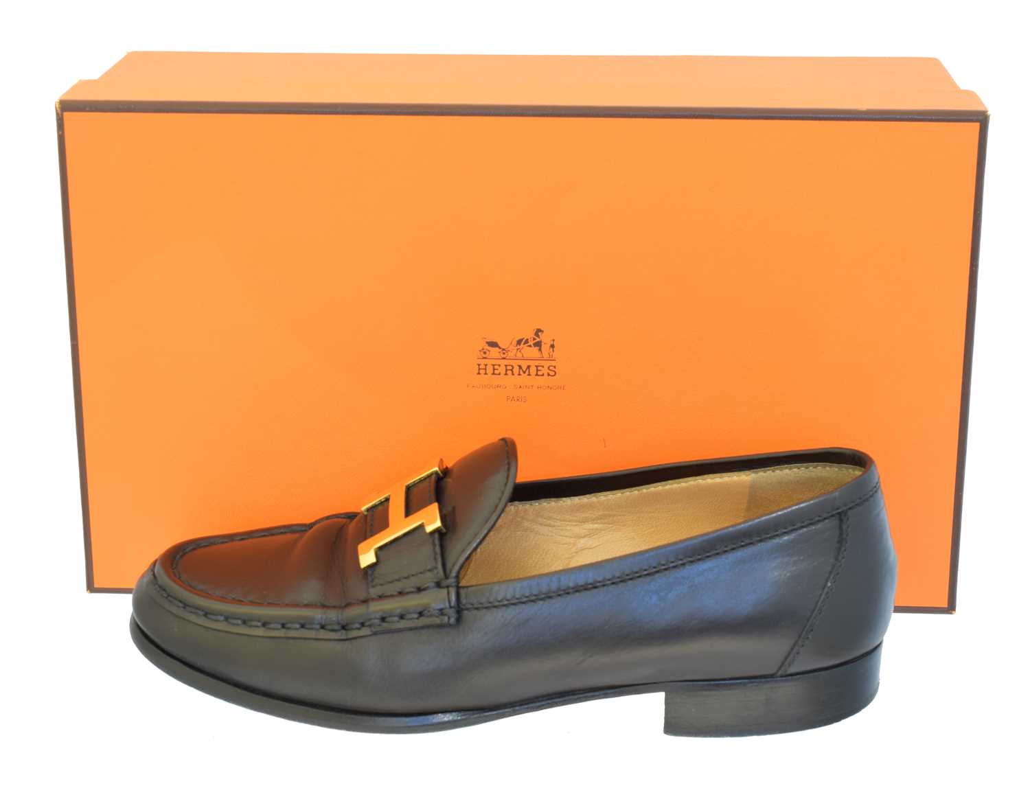 Lot 17 - A pair of Hermès black leather loafers